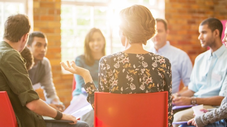 People sitting in a circle having a discussion