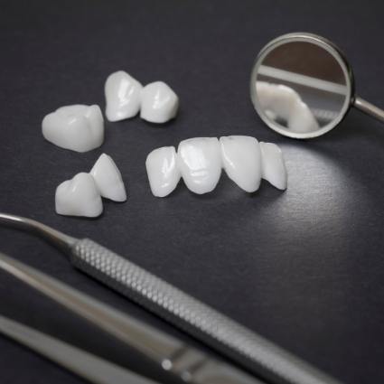 Metal free restorations lying next to dental instruments