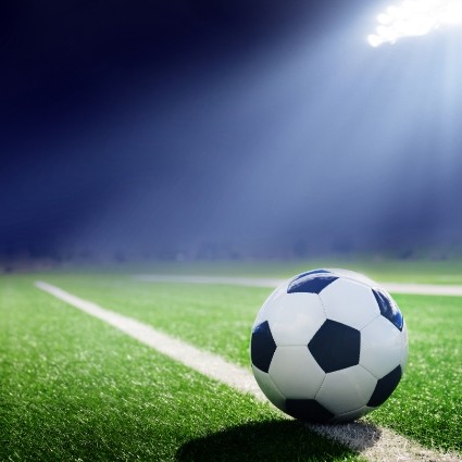 Soccer ball on an empty soccer field