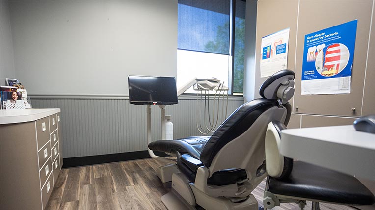 Dental chair in treatment room in dental office