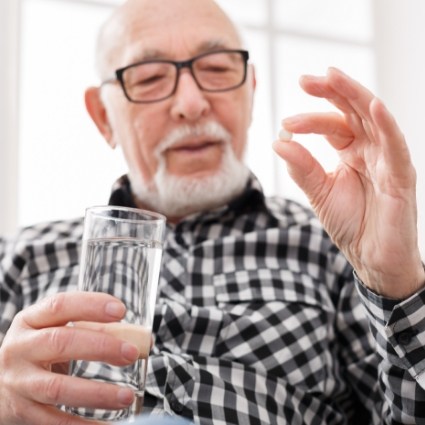 Man about to take pill for sedation dentistry in Rogers