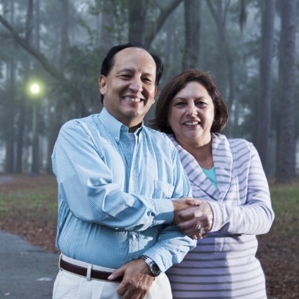 Senior couple smiling in the woods